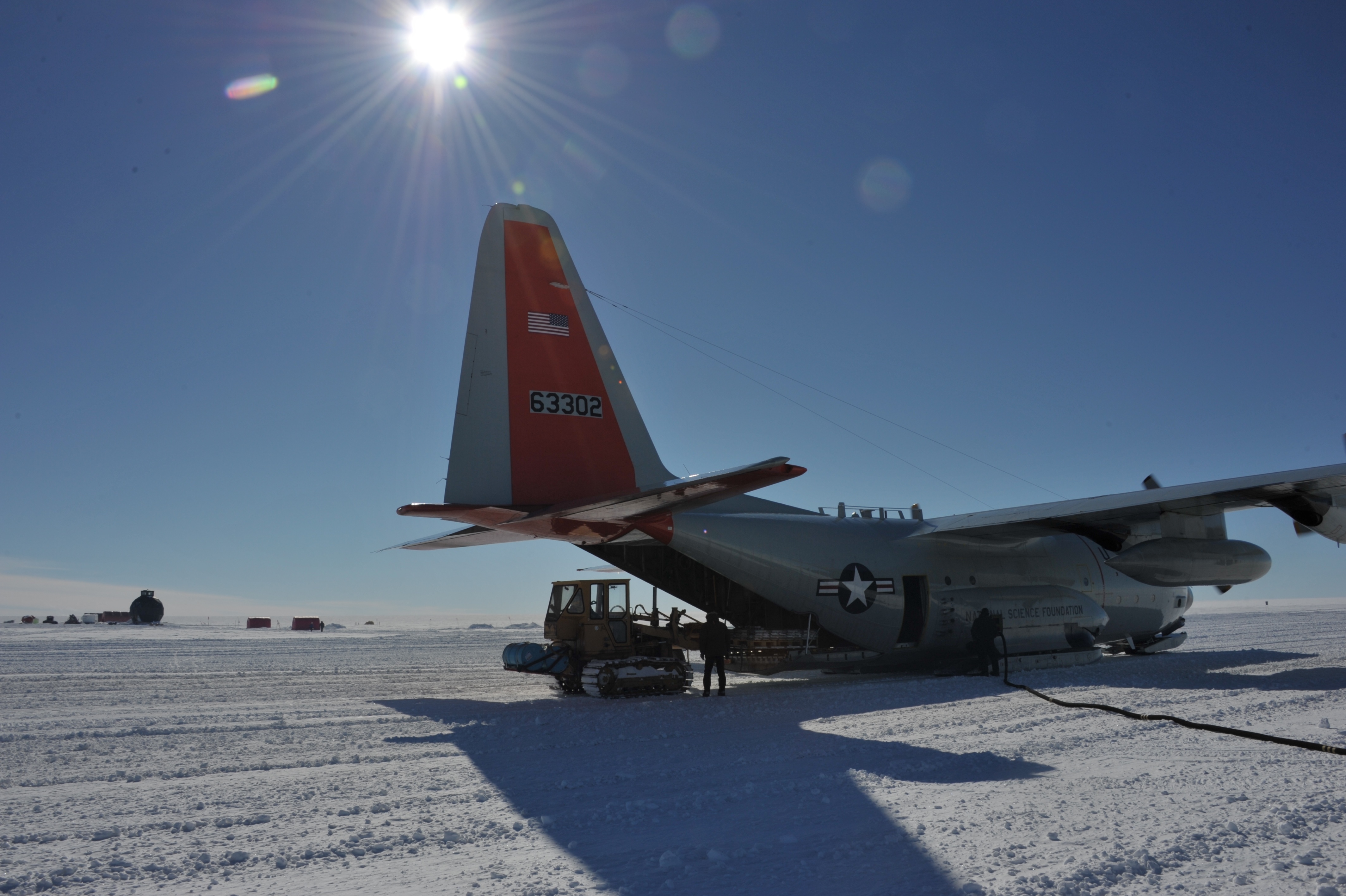 The Caterpillar is loading the LC-130 with cargo to be sent back to Kangerlussuaq